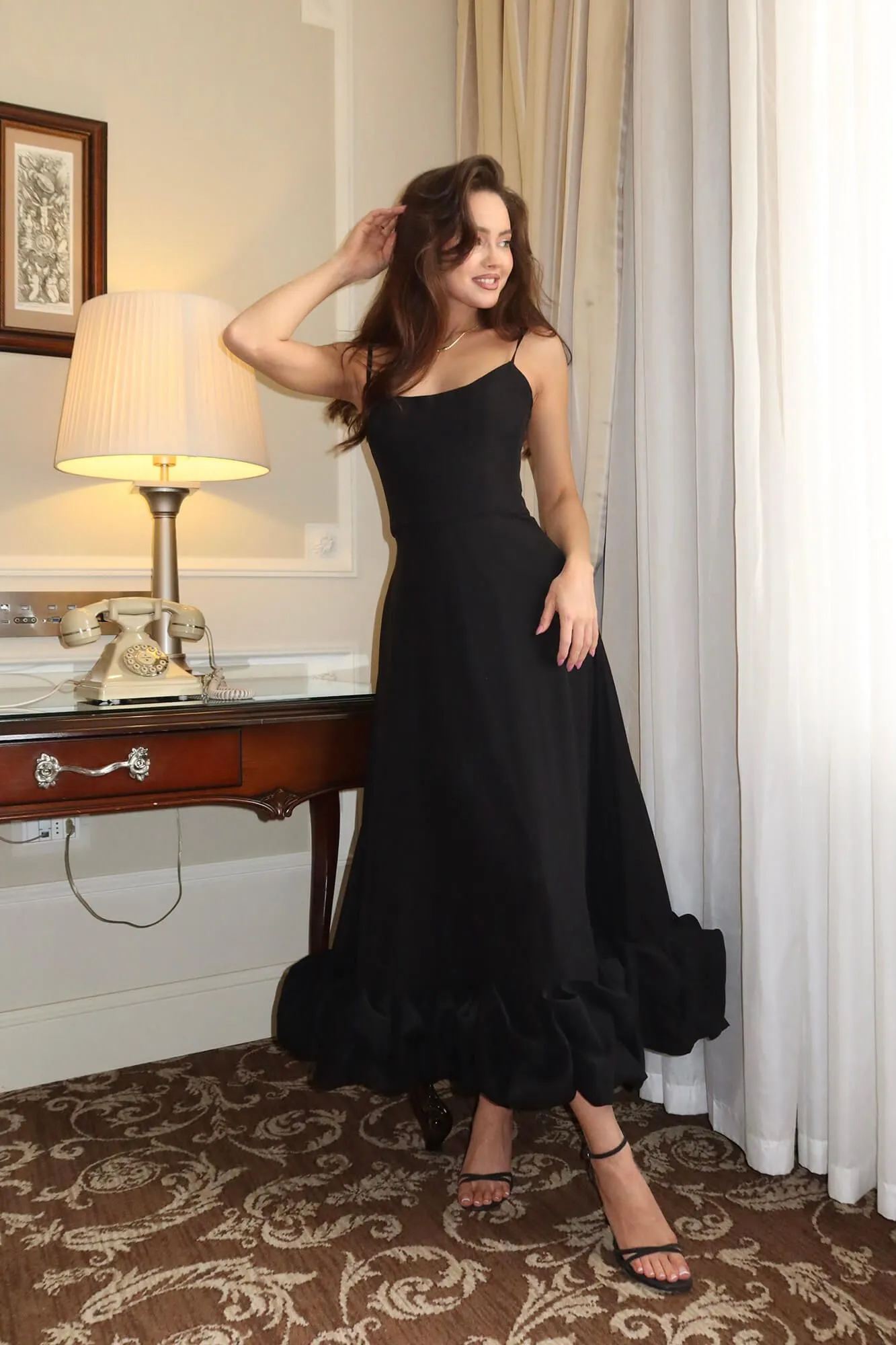 A midi-length bustier dress in black. CremaDress